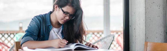 Librarian book holding female reading cover library time bent rule today smiling desk standing behind student stock cv part nerdwallet